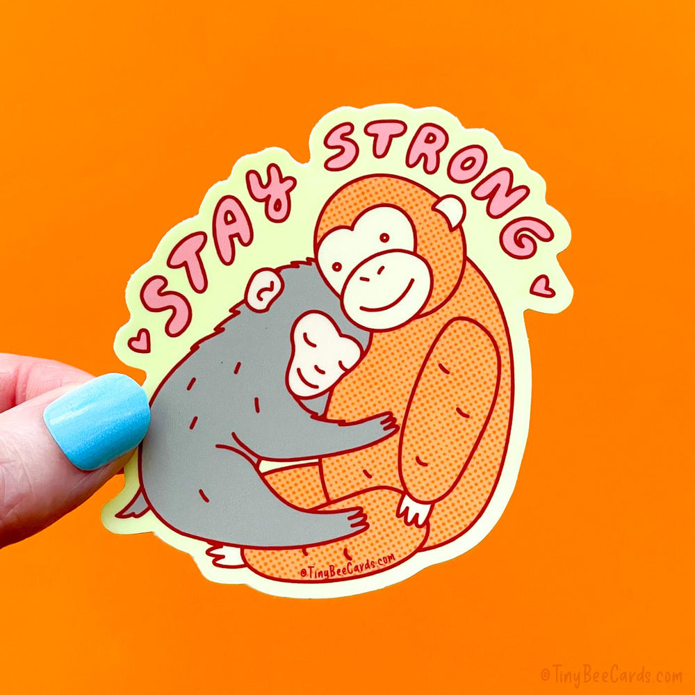 Baby Macaque Monkey with Stuffed Animal "Stay Strong" Punch Vinyl Sticker